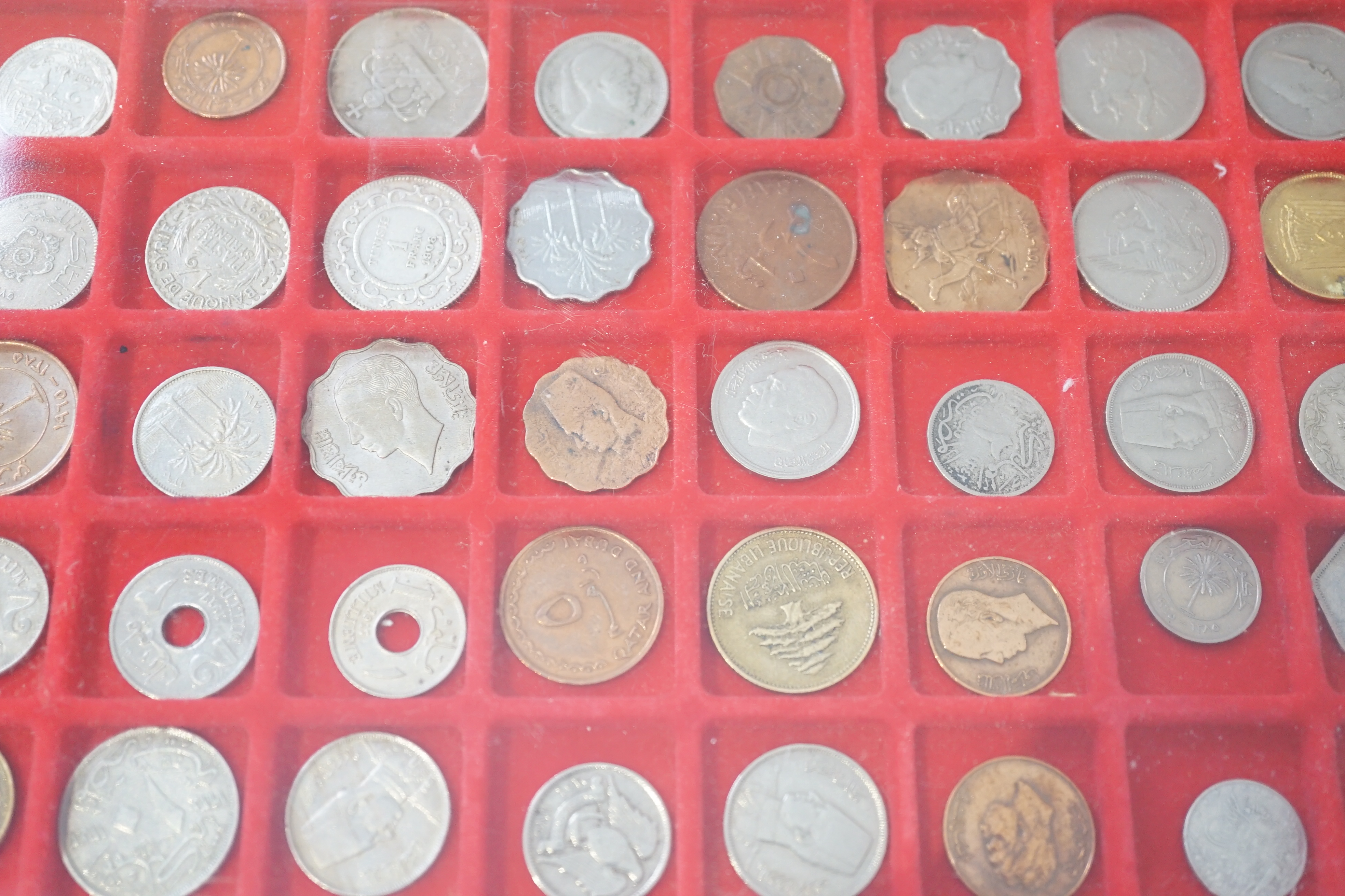 World coins, 20th century to include Tunisia, Palestine, Qatar, France, Italy, USA, housed in cases and a sleeve